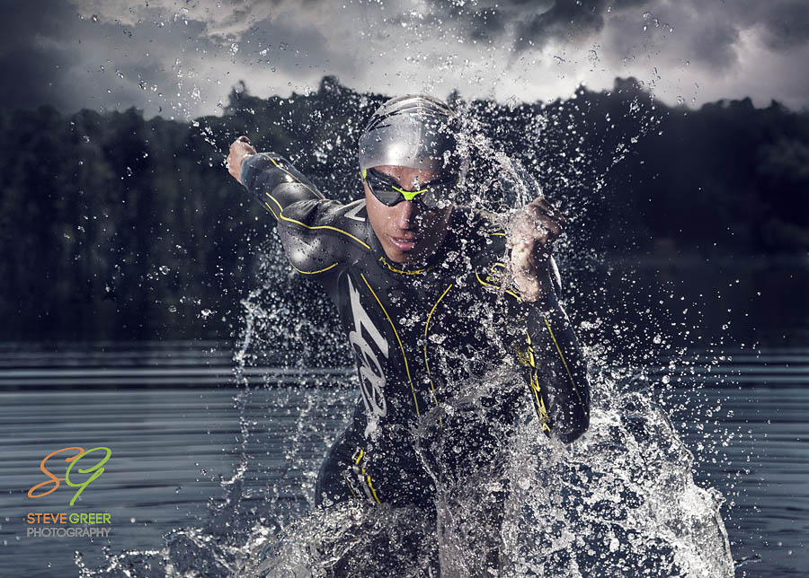 Triathlete running out of the water
