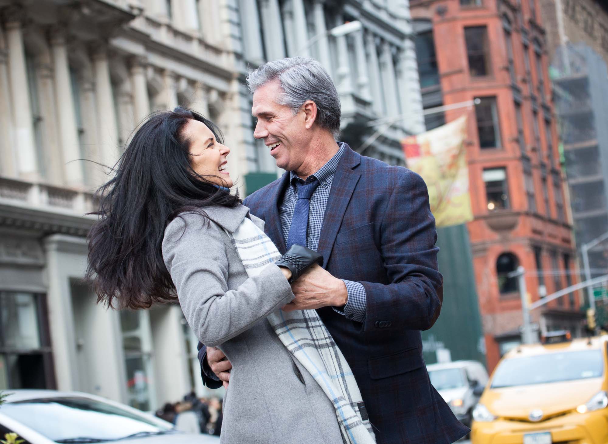 Senior Couple happily dancing together in the city