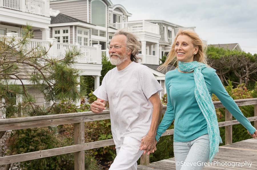 active senior citizen couple walking, exercising to maintain a healthy lifestyle and stay fit